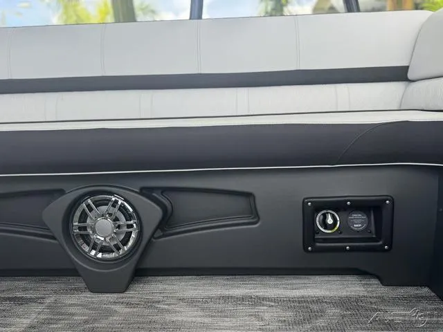 Slide: The Image of Close-up of the 2024 Avalon Catalina Entertainer Funship 27 FT interior speaker and control panel. - 48