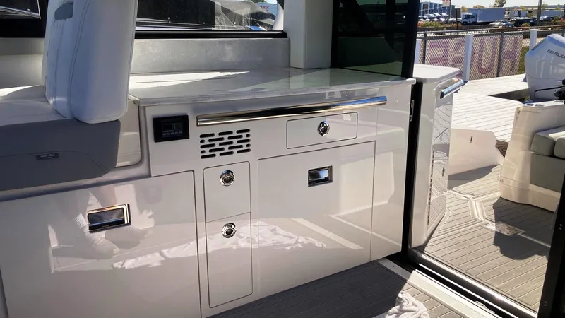 Slide: The Image of 2025 Regal 36 Grande Coupe interior seating area with modern design and comfortable upholstery. - 11