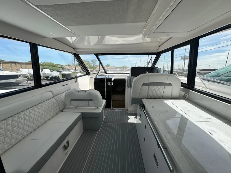 Slide: The Image of Display screen of 2025 Regal 36 Grande Coupe with navigation and engine data. - 14