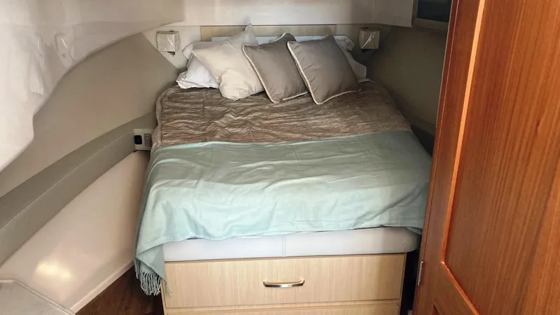 Slide: The Image of Interior of 2025 Regal 36 Grande Coupe yacht, featuring modern helm and seating. - 16