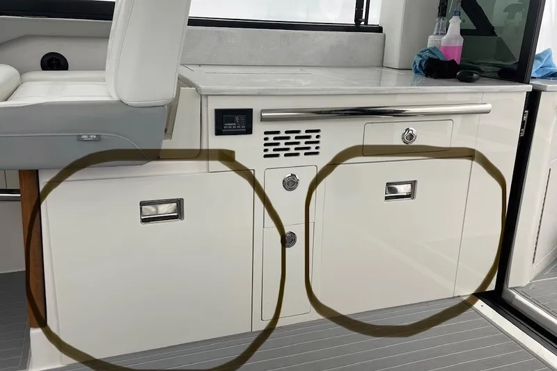 Slide: The Image of Interior of 2025 Regal 36 Grande Coupe with storage compartments and seating. - 62