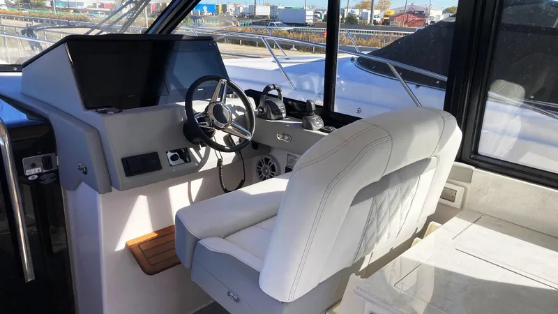 Slide: The Image of 2025 Regal 36 Grande Coupe interior seating with modern design and luxurious upholstery. - 9