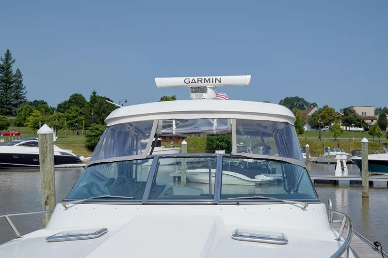 Slide: The Image of 2017 Formula 370 Super Sport boat docked at marina with Garmin radar. - 12
