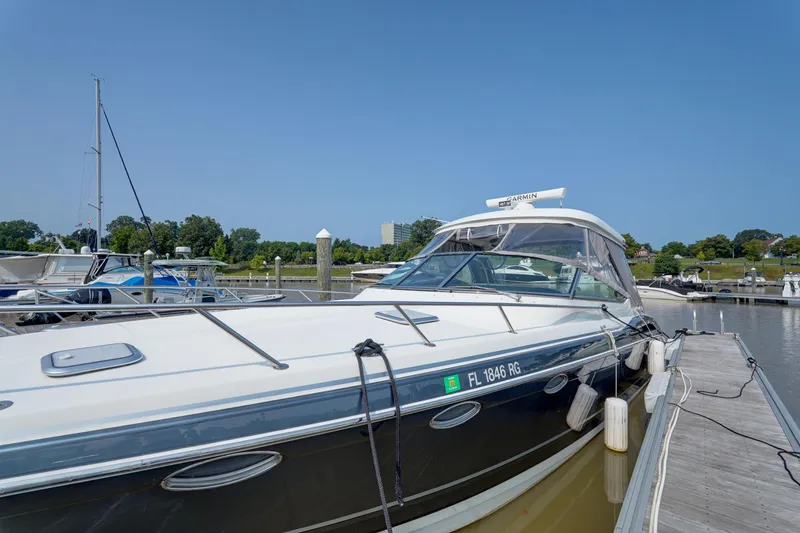 Slide: The Image of 2017 Formula 370 Super Sport yacht docked at marina under clear blue sky. - 13