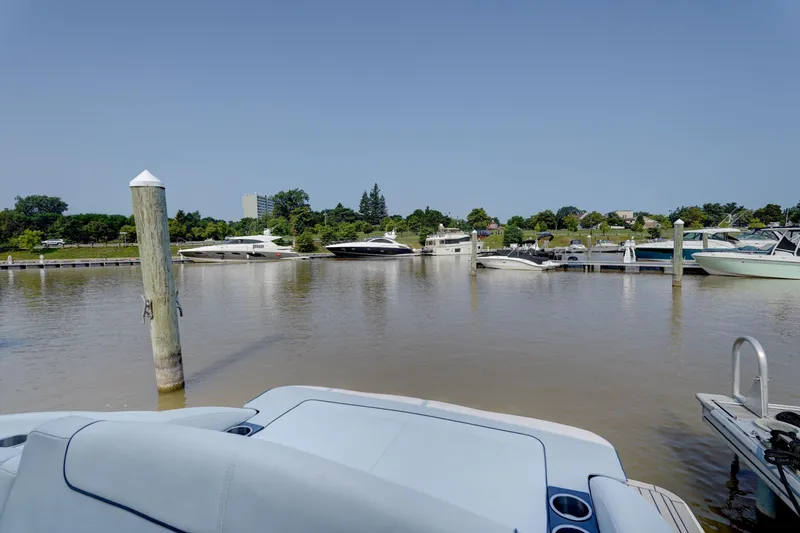 Slide: The Image of 2017 Formula 370 Super Sport docked in a marina with other boats. - 18