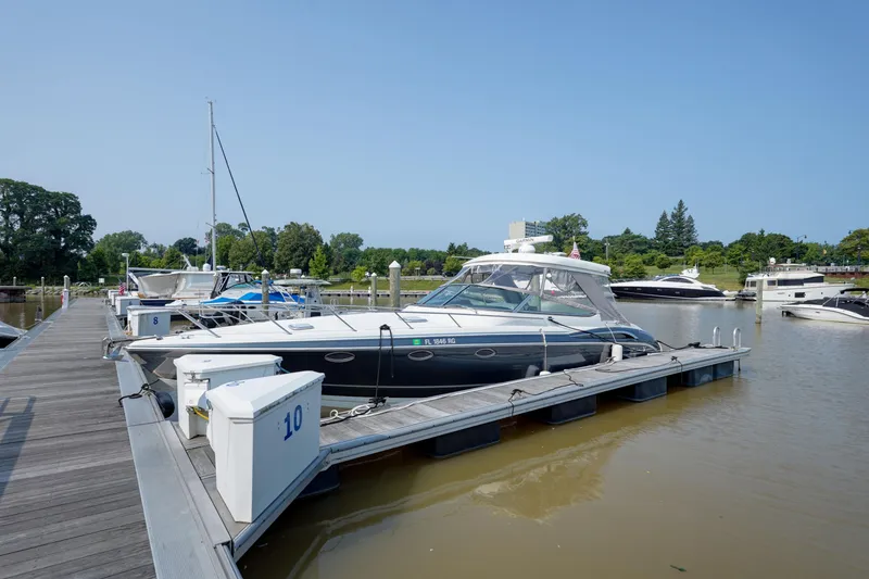 Slide: The Image of 2017 Formula 370 Super Sport yacht docked at marina on a sunny day. - 2