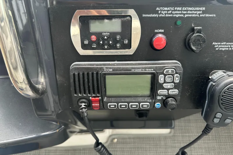 Slide: The Image of Control panel of a 2017 Formula 370 Super Sport boat with communication and safety equipment. - 27