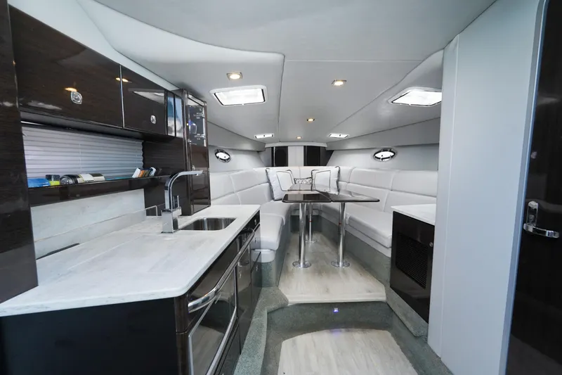 Slide: The Image of Interior of 2017 Formula 370 Super Sport yacht with modern kitchen and seating area. - 31