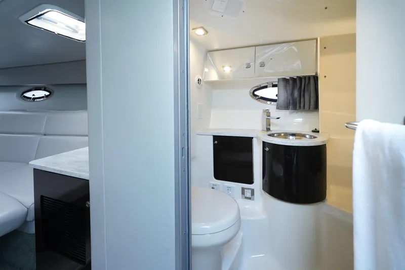 Slide: The Image of 2017 Formula 370 Super Sport yacht interior with modern bathroom and seating area. - 34