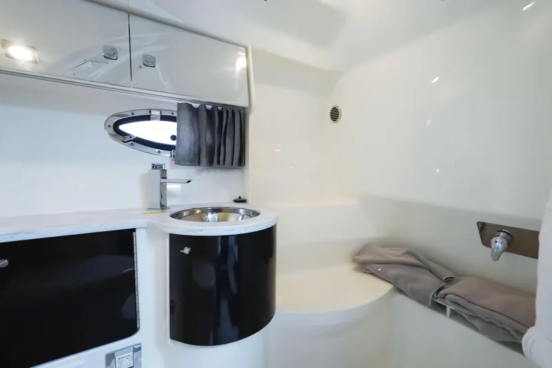 Slide: The Image of 2017 Formula 370 Super Sport bathroom interior with sink, storage, and porthole. - 35