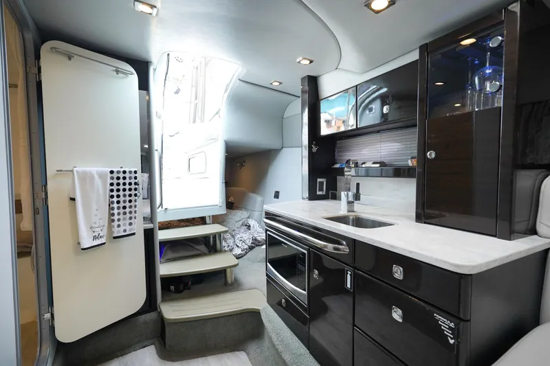 Slide: The Image of Interior of 2017 Formula 370 Super Sport yacht, featuring modern kitchen and sleek design. - 38