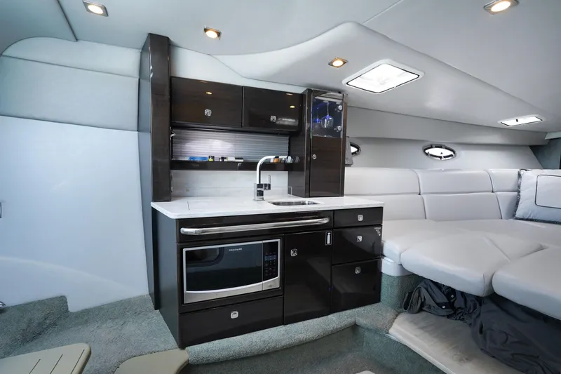 Slide: The Image of Luxurious interior of 2017 Formula 370 Super Sport yacht with modern kitchenette and seating area. - 39