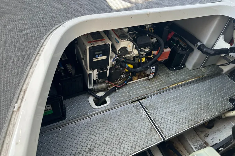 Slide: The Image of Engine compartment of a 2017 Formula 370 Super Sport boat, showcasing mechanical components. - 47