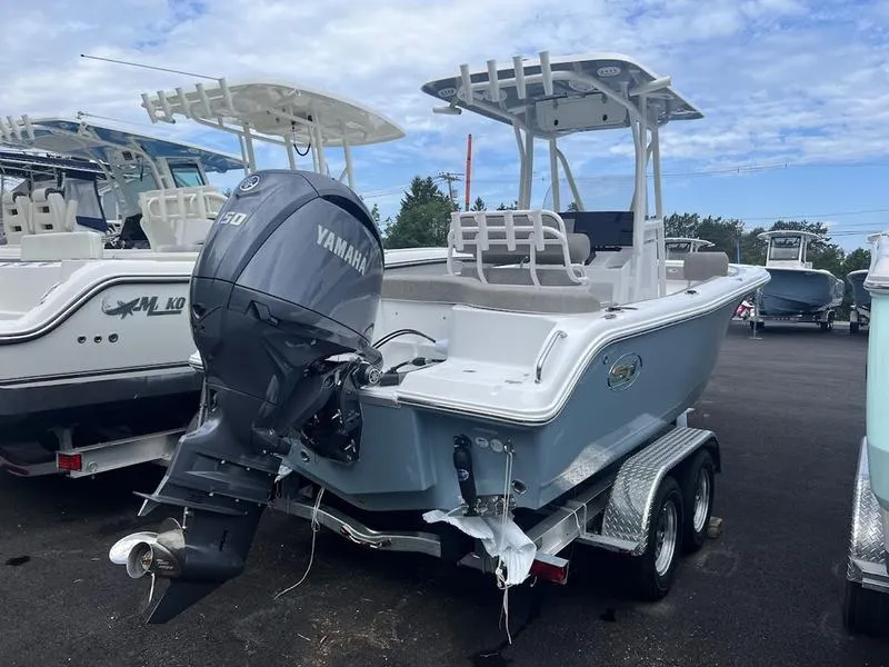 Slide: The Image of 2025 Sea Hunt Ultra 219 boat with Yamaha outboard motor on trailer. - 10