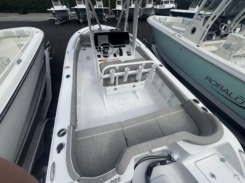 Slide: The Image of 2025 Sea Hunt Ultra 219 boat interior with seating and console. - 13