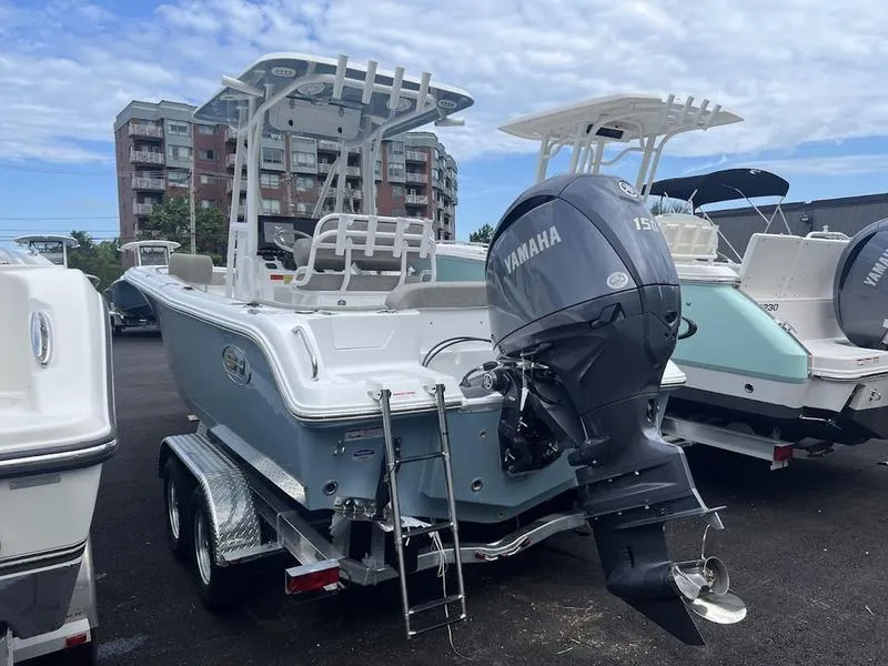 Slide: The Image of 2025 Sea Hunt Ultra 219 boat with Yamaha outboard motor on trailer. - 14