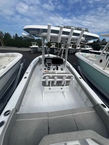 Slide: The Image of 2025 Sea Hunt Ultra 219 boat with center console and T-top. - 15