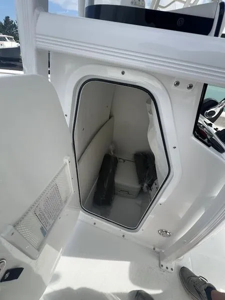 Slide: The Image of 2025 Sea Hunt Ultra 219 boat interior storage compartment - 17