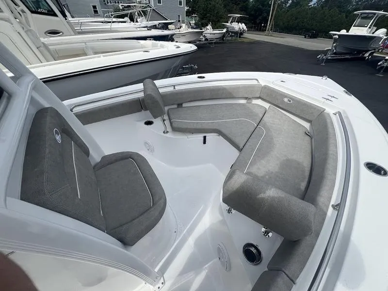 Slide: The Image of 2025 Sea Hunt Ultra 219 boat with spacious seating and modern design. - 20