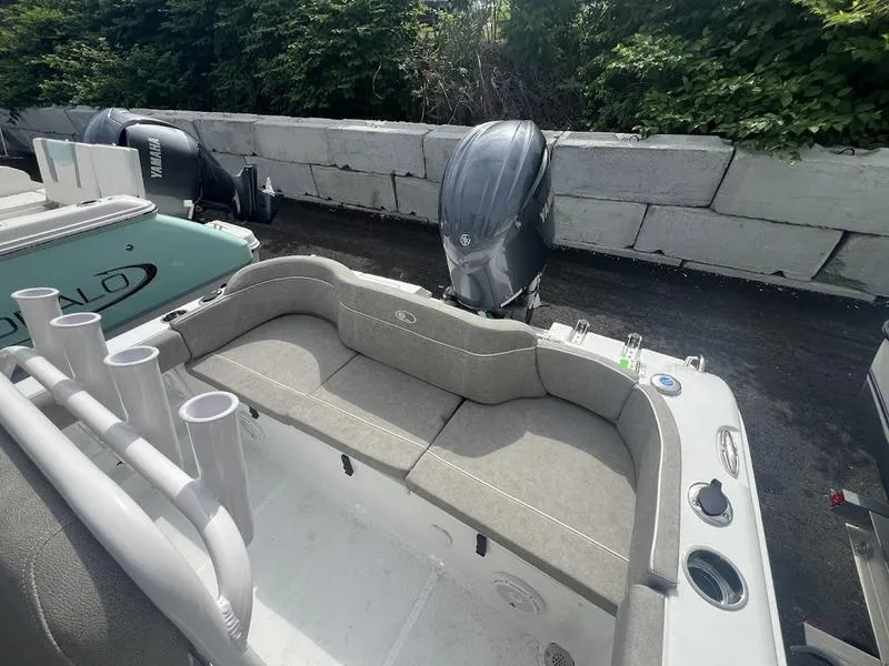 Slide: The Image of 2025 Sea Hunt Ultra 219 boat with cushioned seating and Yamaha outboard motor. - 3