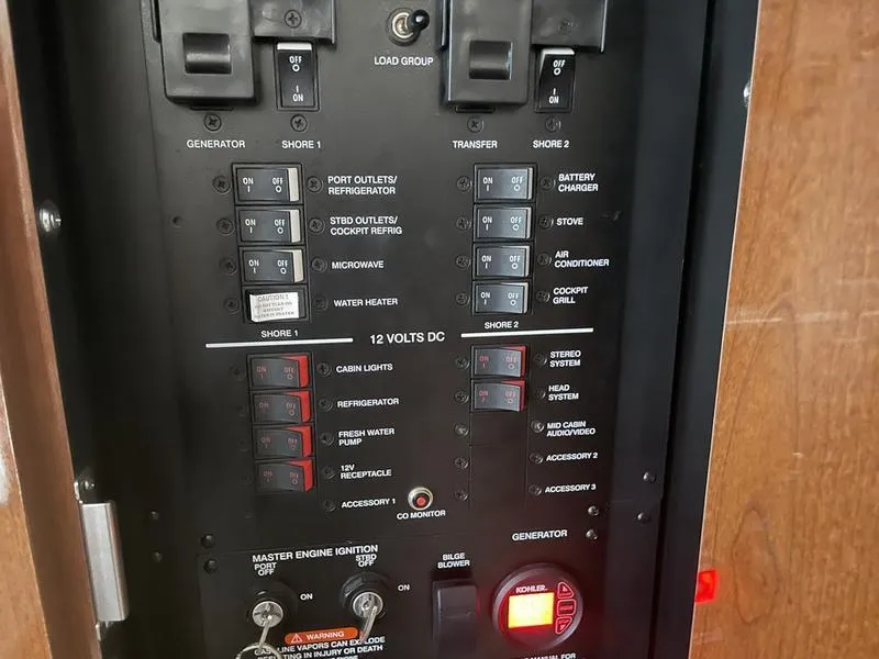 Slide: The Image of Electrical control panel of a 2014 Sea Ray 310 Sundancer boat. - 13
