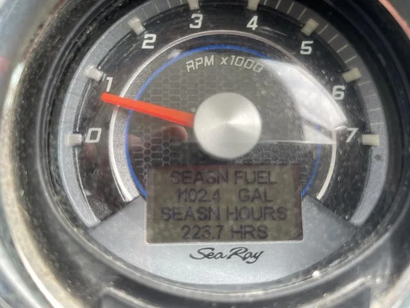 Slide: The Image of Close-up of Sea Ray 310 Sundancer 2014 RPM gauge showing fuel and hours. - 6