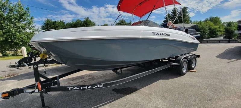 Slide: The Image of 2024 Tahoe T21 boat on trailer with red canopy. - 1