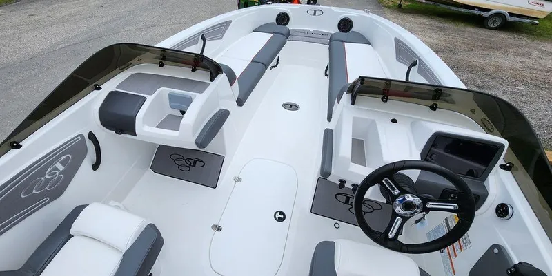 Slide: The Image of 2024 Tahoe T21 boat interior with modern seating and steering wheel. - 3