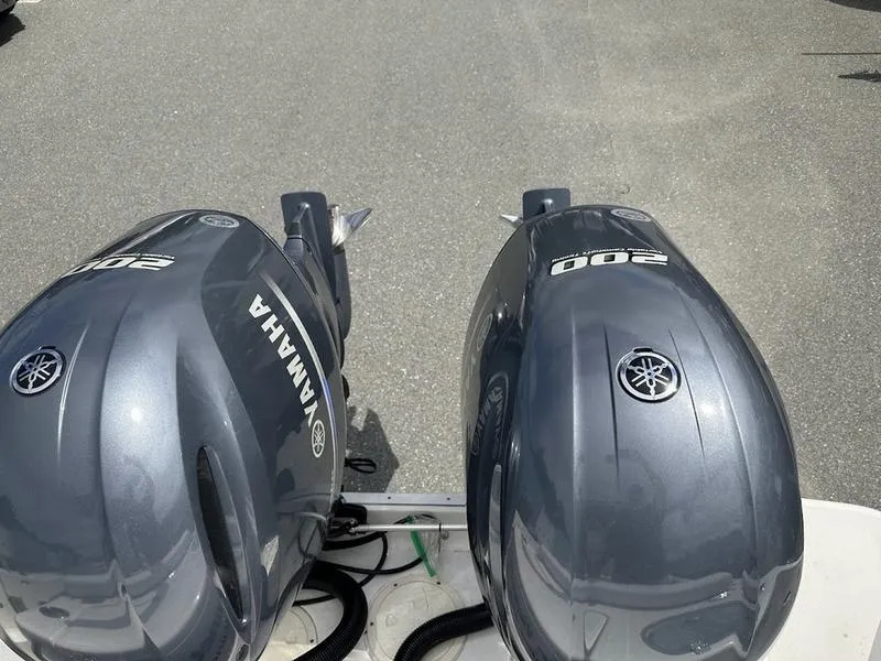 Slide: The Image of Twin Yamaha 200 outboard engines on a 2022 Robalo R242 boat. - 21