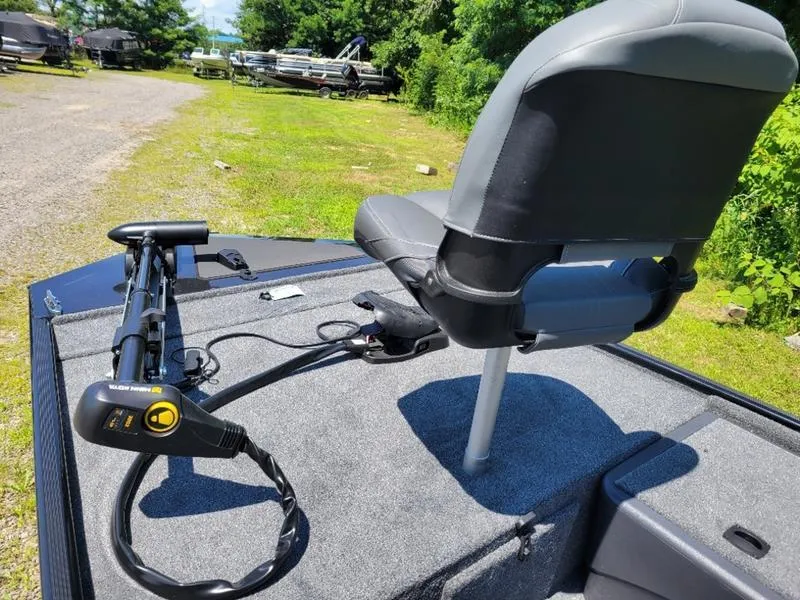 Slide: The Image of 2024 Tracker BT CLASSIC XL boat with a mounted trolling motor and swivel seat. - 2