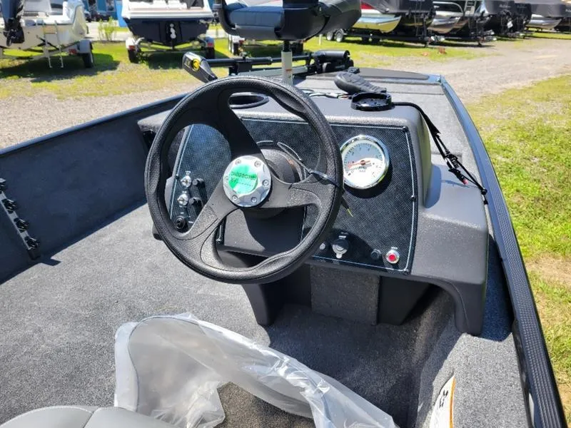 Slide: The Image of 2024 Tracker BT CLASSIC XL boat dashboard with steering wheel and gauges. - 3