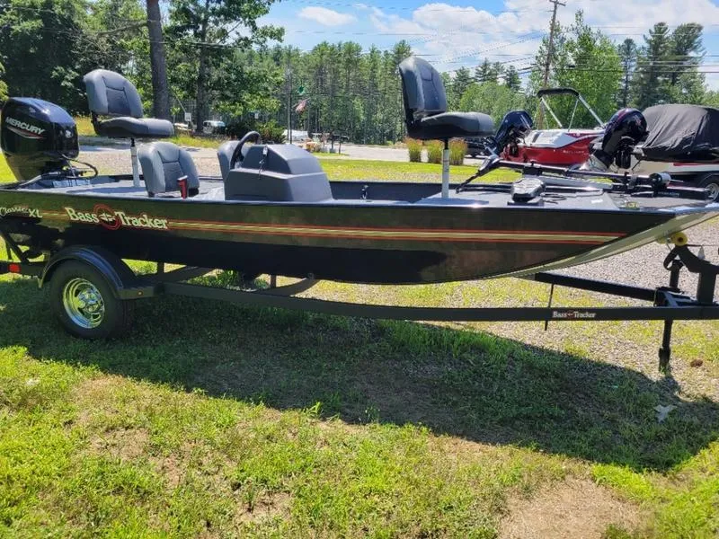 Slide: The Image of 2024 Tracker BT CLASSIC XL fishing boat on trailer, parked on grass. - 8
