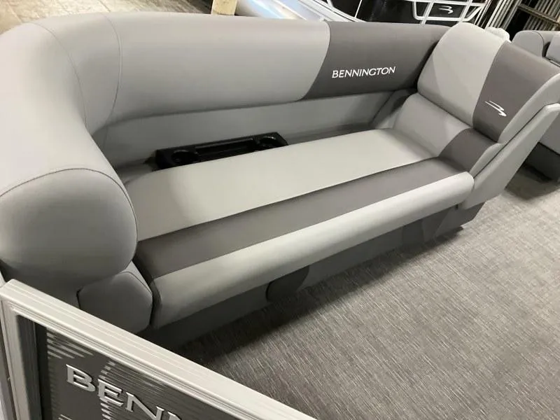 Slide: The Image of 2024 Bennington 20 SVSR boat seating, featuring sleek gray upholstery and integrated cup holders. - 12