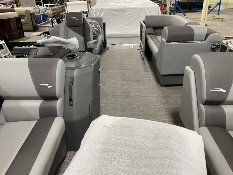 Slide: The Image of 2024 Bennington 20 SVSR pontoon boat interior with gray seating and modern design. - 4