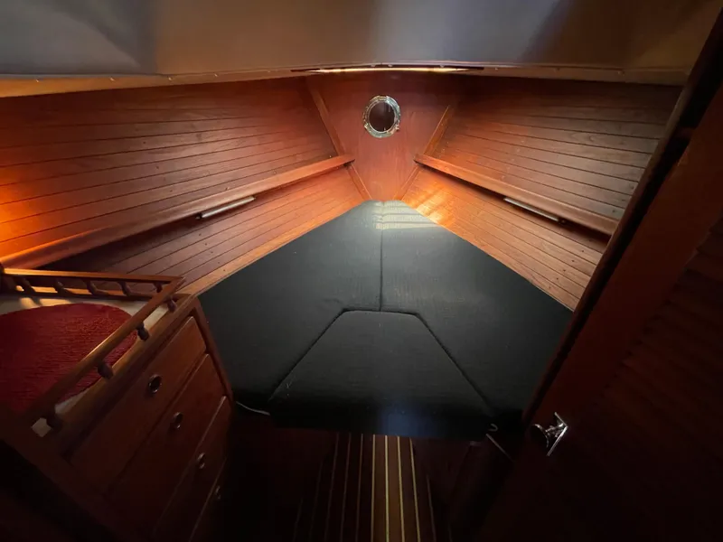 Slide: The Image of 1978 CAL 2-39 yacht cabin with wooden interior and cozy sleeping area. - 16