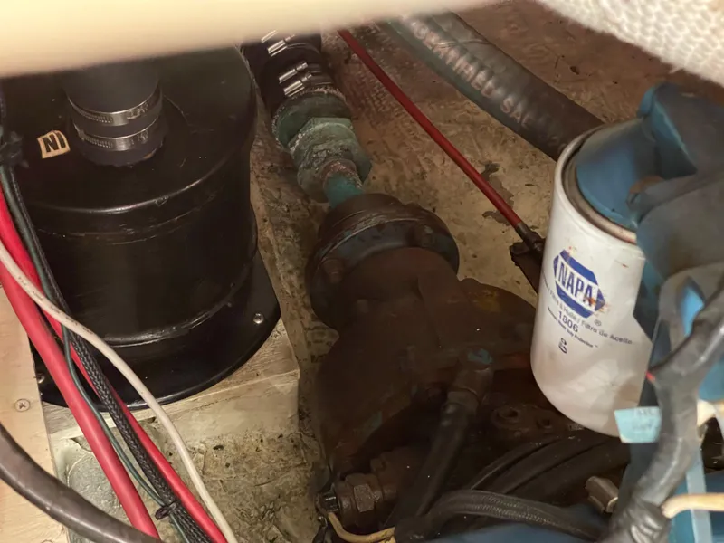 Slide: The Image of Engine compartment of a 1978 CAL 2-39 sailboat with visible components and wiring. - 23