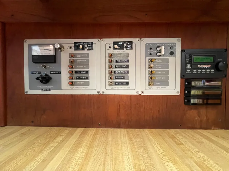 Slide: The Image of Electrical control panel on a 1978 CAL 2-39 boat with switches and gauges. - 24