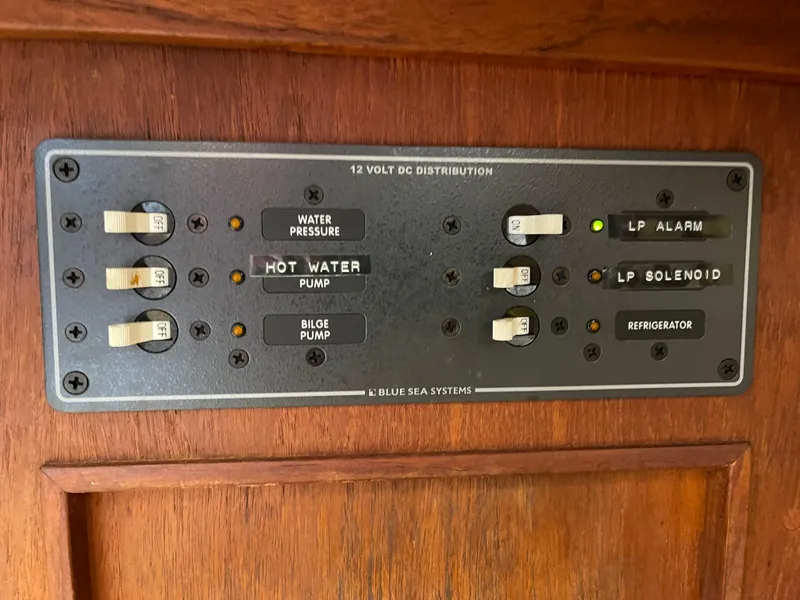Slide: The Image of 1978 CAL 2-39 control panel with switches for water, hot water, bilge, and refrigerator. - 25