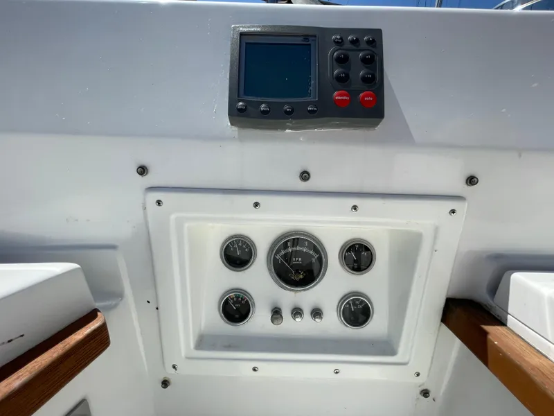 Slide: The Image of 1978 CAL 2-39 boat dashboard with gauges and electronic display. - 26