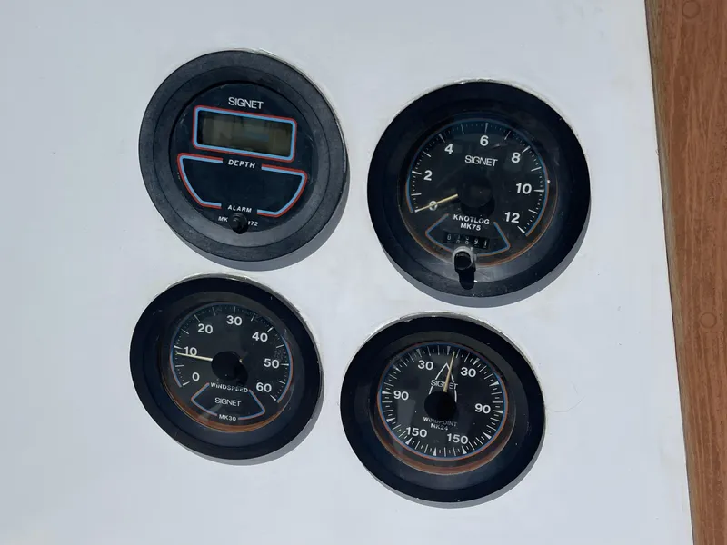 Slide: The Image of Four vintage boat gauges on a CAL 2-39, 1978 model. - 27