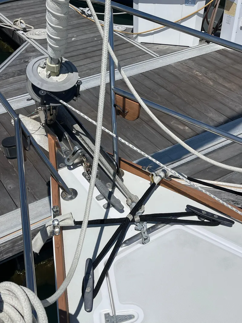 Slide: The Image of 1978 CAL 2-39 sailboat deck with rigging and dock in background. - 29