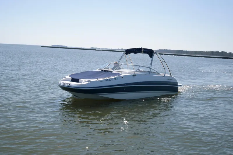 The Image of 2009 Four Winns 274 Funship boat cruising on a calm lake. - 0