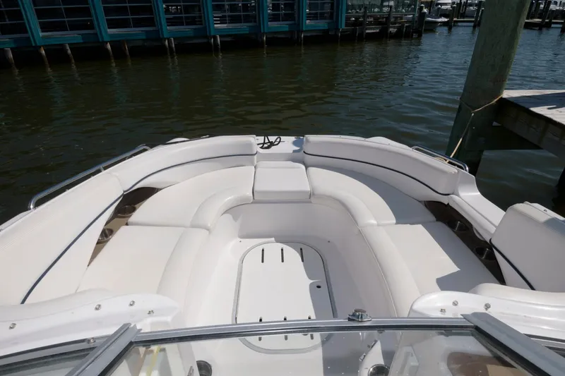 Slide: The Image of 2009 Four Winns 274 Funship boat with spacious seating area docked at marina. - 3