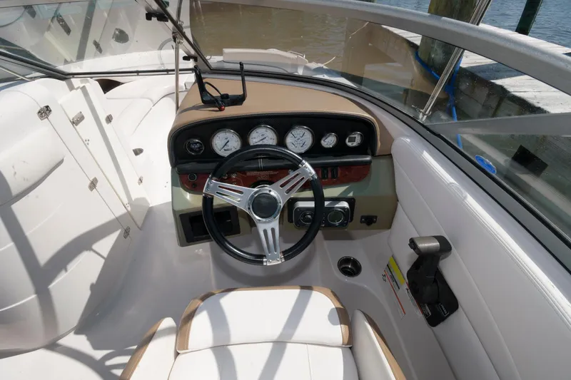 Slide: The Image of 2009 Four Winns 274 Funship boat cockpit with steering wheel and instrument panel. - 5