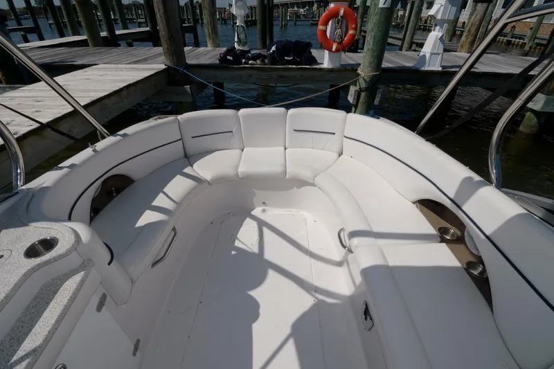 Slide: The Image of 2009 Four Winns 274 Funship boat interior with white seating at dock. - 7