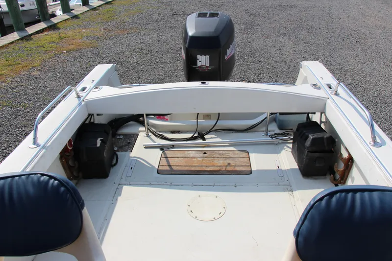 Slide: The Image of 1985 Boston Whaler Revenge 22 boat interior with outboard motor. - 11
