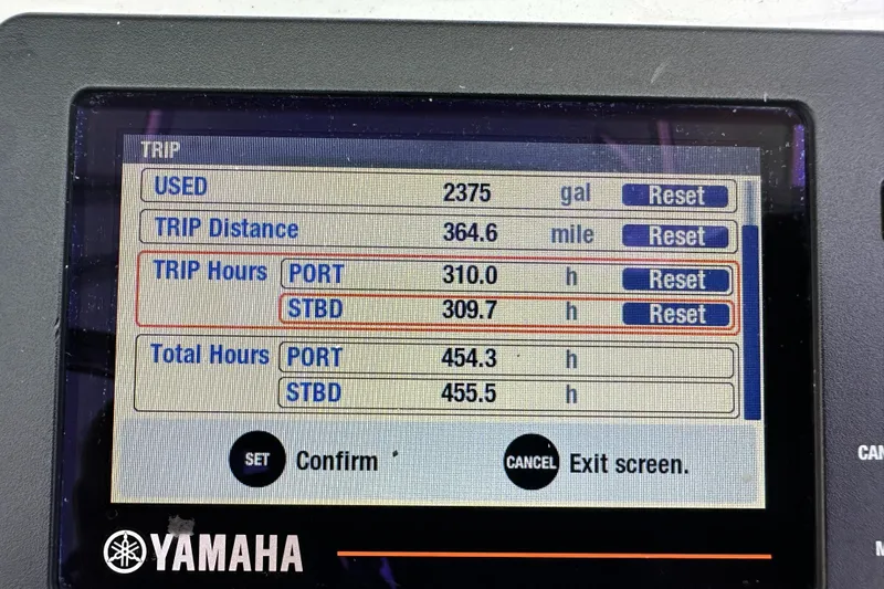 Slide: The Image of Yamaha trip monitor display on 2018 Contender 24 Sport boat showing fuel and trip data. - 17