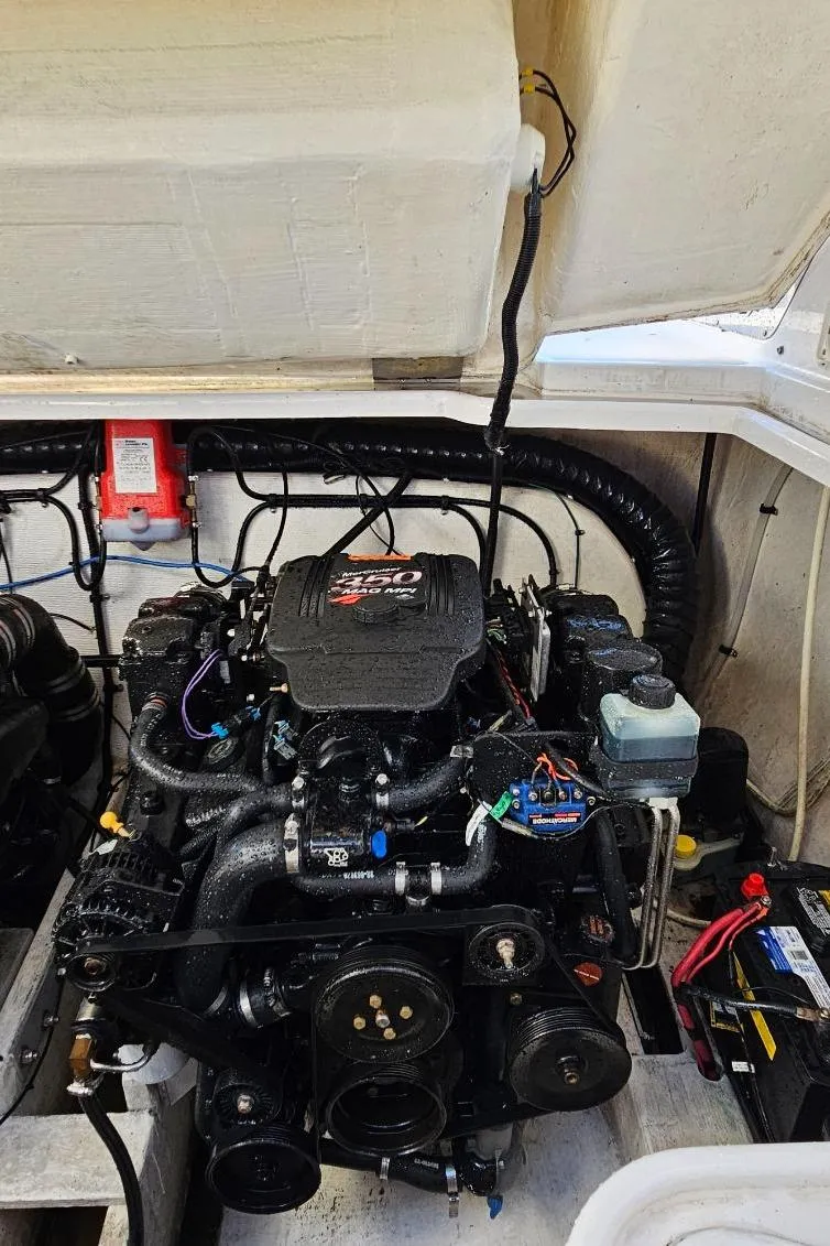 Slide: The Image of Engine compartment of a 2003 Powerquest 280 SC boat. - 30