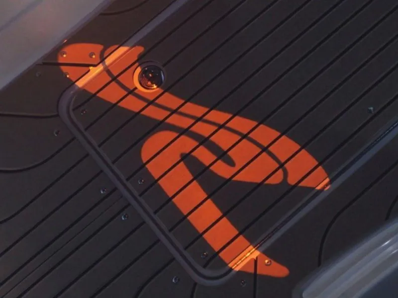 Slide: The Image of Illuminated Sea Ray logo on the deck of a 2023 Sea Ray SLX 260 boat. - 7