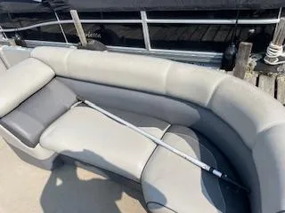 Slide: The Image of Premier 220 SunSation 2018 boat with gray seating and a boat hook on the deck. - 4